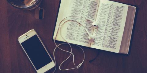 Bible with iPhone, earbuds and tea