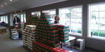 Boxes stacked high with a smile